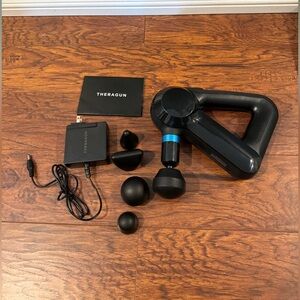 Theragun Elite Bluetooth + App Enabled Massage Gun + 5 Attachments, 40lbs Force
